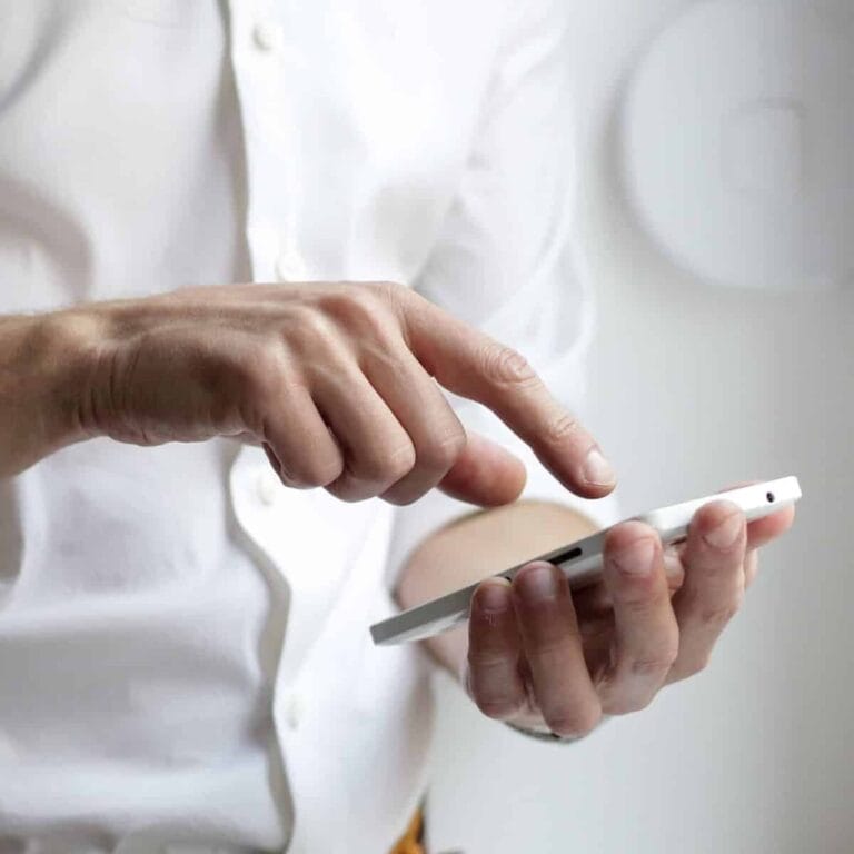 Mobile phone in hand, company person using smartphone, business technology communication.