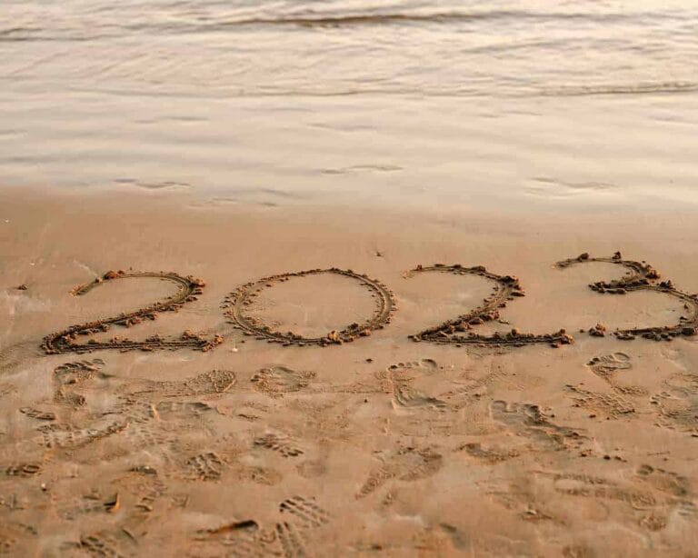 2023 New Year on the Beach, Celebration, Sand Writing, Optimism, Fresh Start.