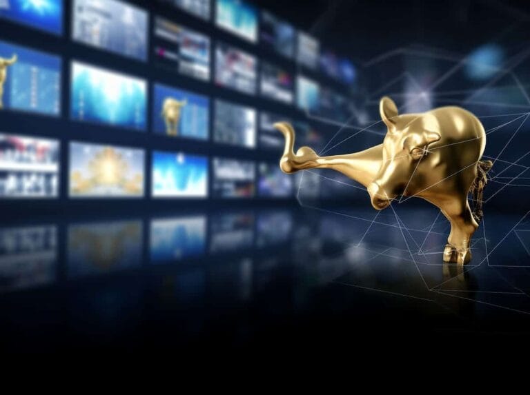 Shiny gold bull statue in front of a digital stock market display, symbolising financial growth and investment opportunities.